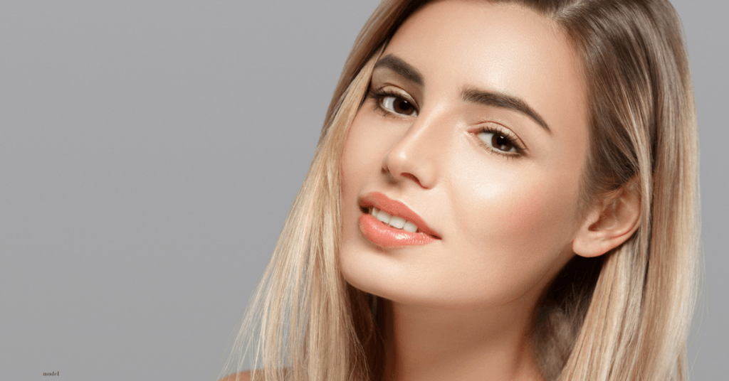 Headshot of female model with sandy blonde hair