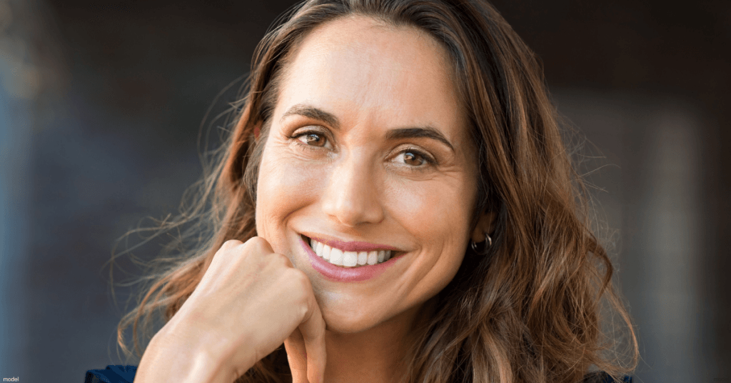 Headshot of smiling female with brown hair