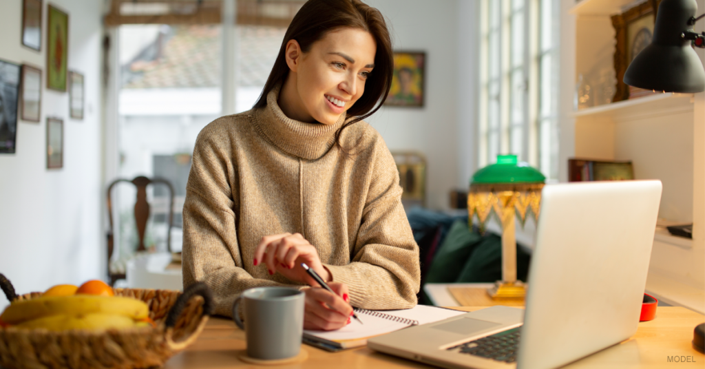 Woman smiles during her Zoom meeting.