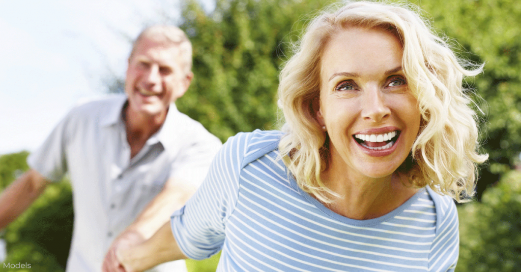 Cheerful older woman and man spending time outdoors
