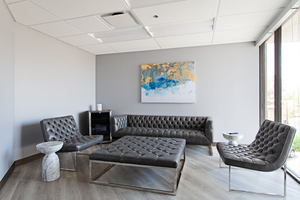 The beautifully designed waiting area blends comfort and elegance to create a welcoming environment for all patients.