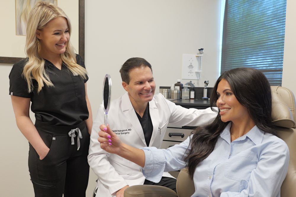Dr. Hobgood discussing beautiful results with a happy patient